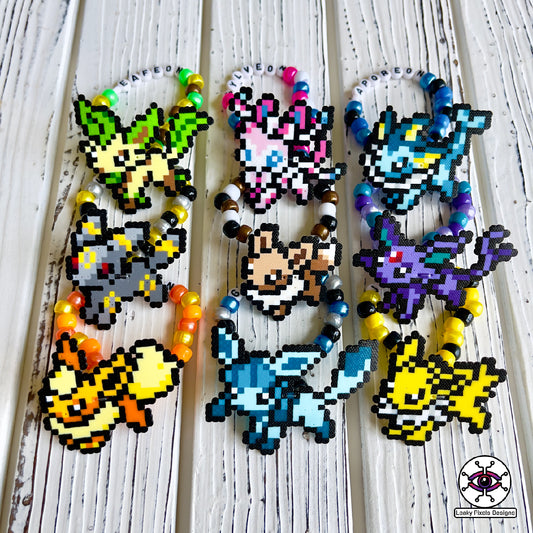 Eeevee pokemon evolutions perler bracelets. Vaporeon, Jolteon, Flareon, Espeon, Umbreon, Leafeon, Glaceon, and Sylveon by leaky pixels.