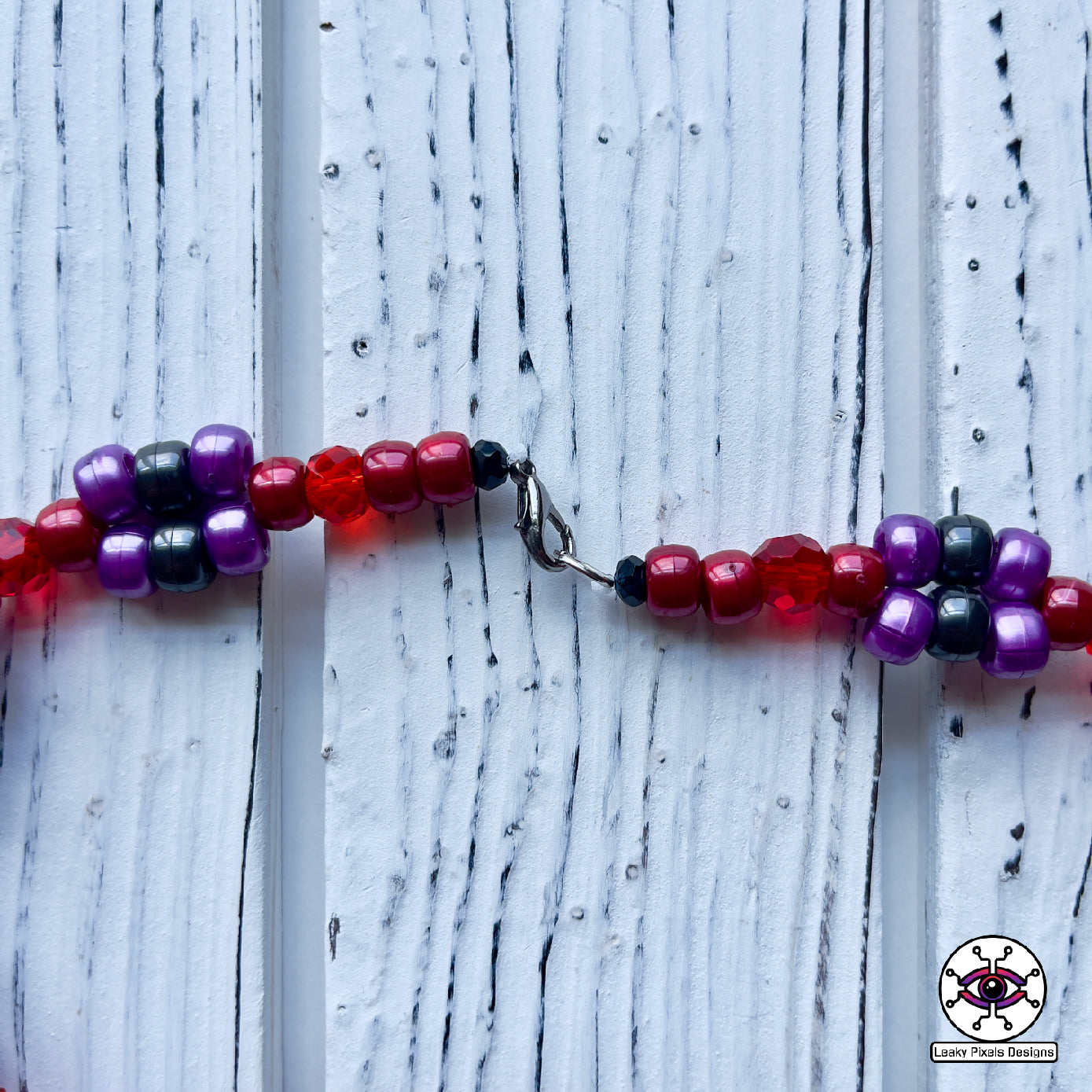 blood cyclops perler necklace by leaky pixels