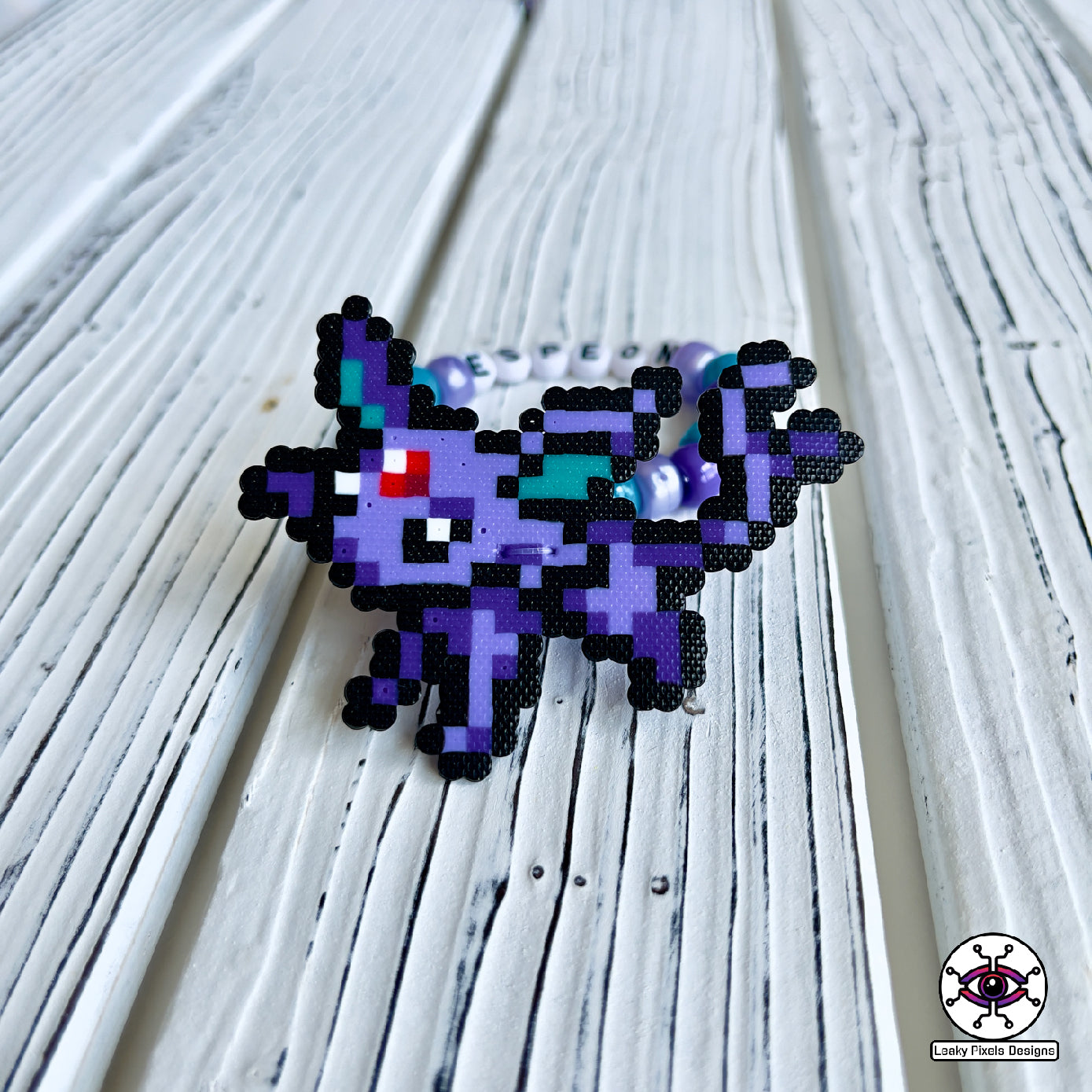 Eeevee pokemon evolutions perler bracelets. Vaporeon, Jolteon, Flareon, Espeon, Umbreon, Leafeon, Glaceon, and Sylveon by leaky pixels.
