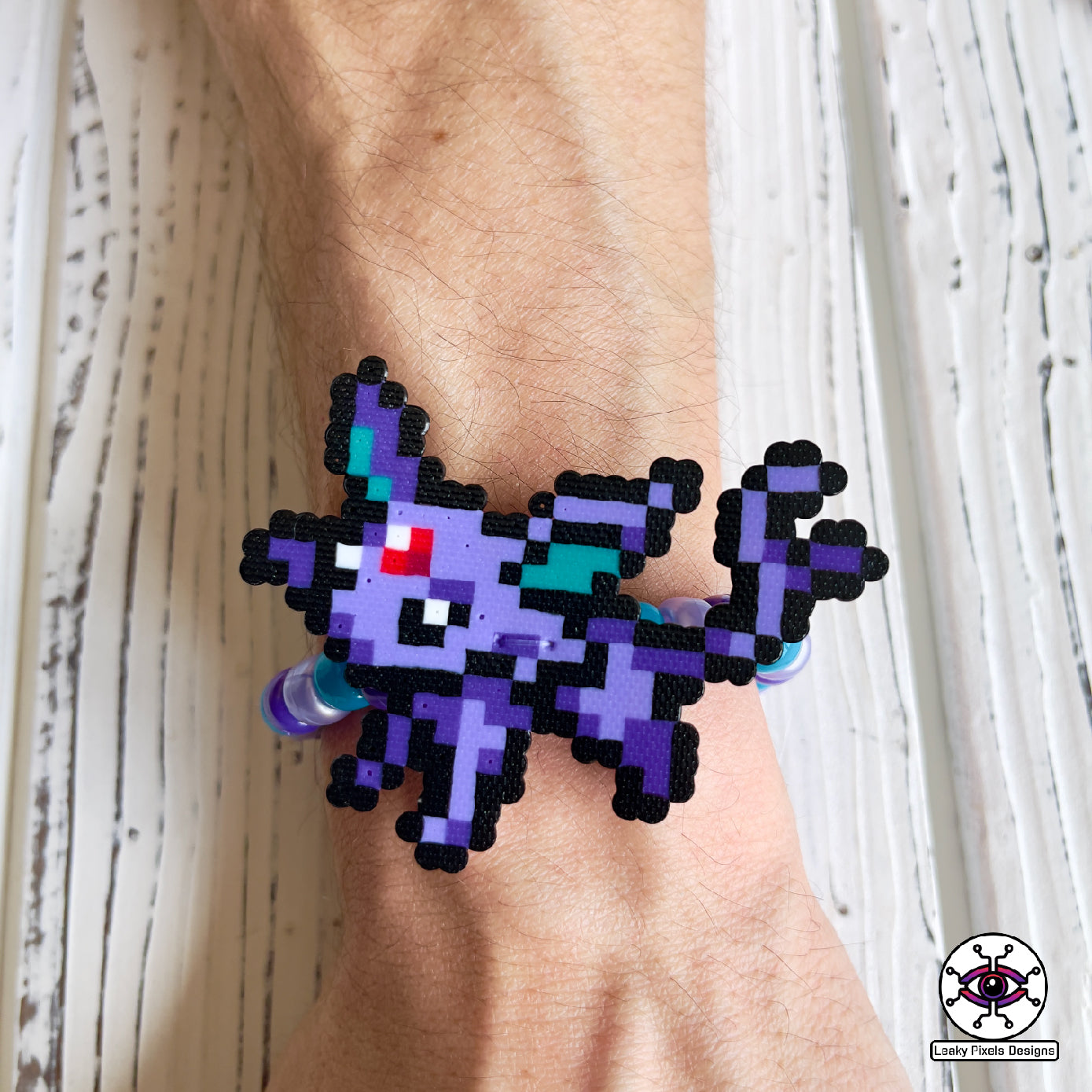 Eeevee pokemon evolutions perler bracelets. Vaporeon, Jolteon, Flareon, Espeon, Umbreon, Leafeon, Glaceon, and Sylveon by leaky pixels.