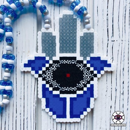 Evil eye perler necklace by leaky pixels. white and  blue with black eye