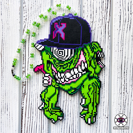 Excision Subtronics Cyclops Perler Necklace Green. One eyed green cyclops monster with hypnotizing rezz spiral eye. Two mouths are on each side of its head one with its tongue sticking out. big grin on its face bearing teeth and long hands below him.