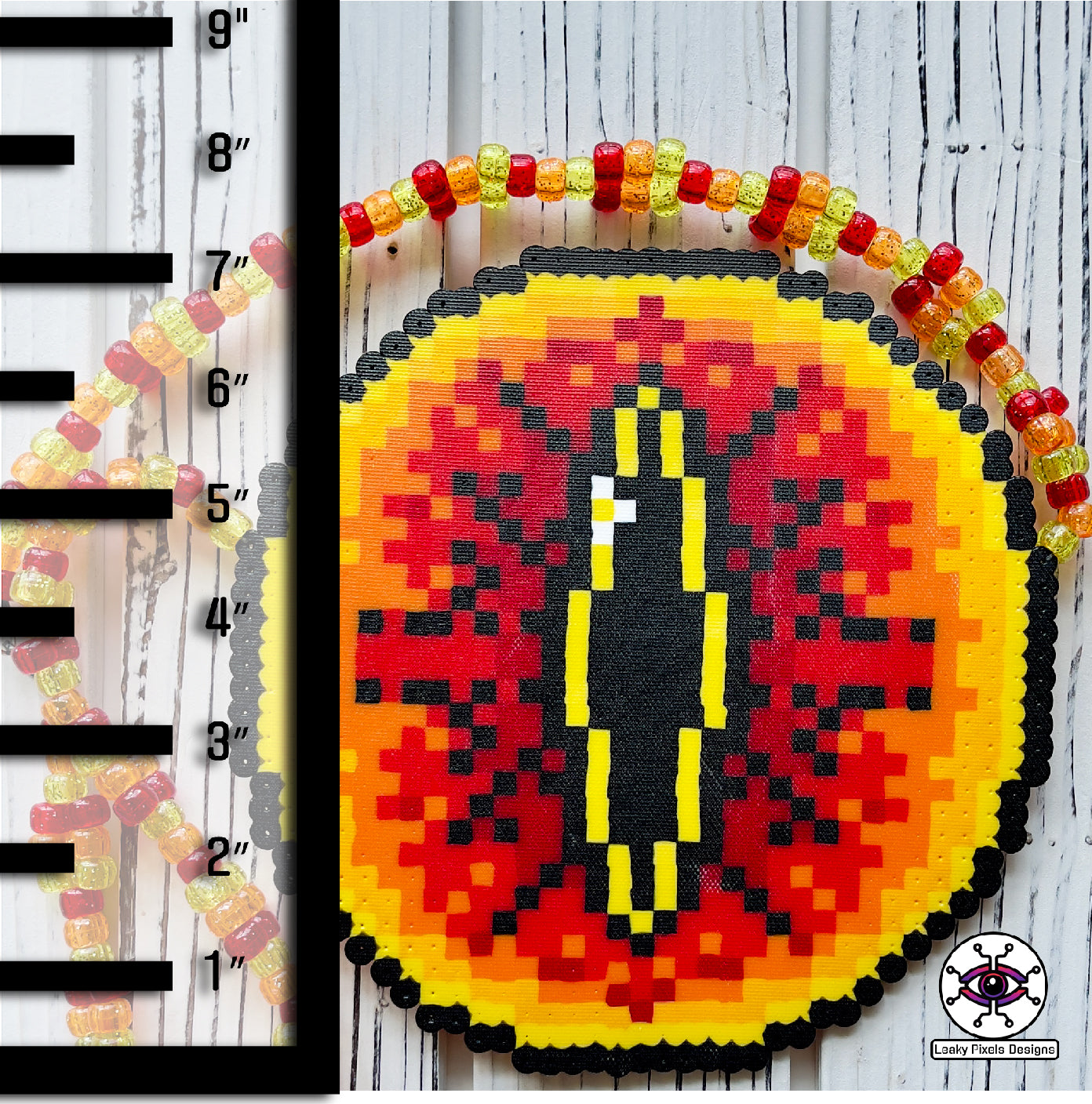 Eye of sauron perler necklace. Large fiery eye with darkness inside it. from Lord of the rings. has red, orange and yellow pony beads as a necklace.