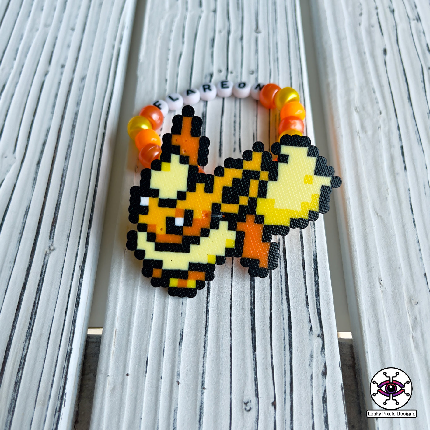 Eeevee pokemon evolutions perler bracelets. Vaporeon, Jolteon, Flareon, Espeon, Umbreon, Leafeon, Glaceon, and Sylveon by leaky pixels.