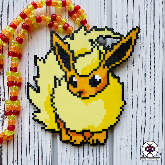Flareon perler necklace, Orange and yellow pokemon that is dog like and fluffy. pointy ears also. necklace is made out of red, orange and yellow glitter pony beads