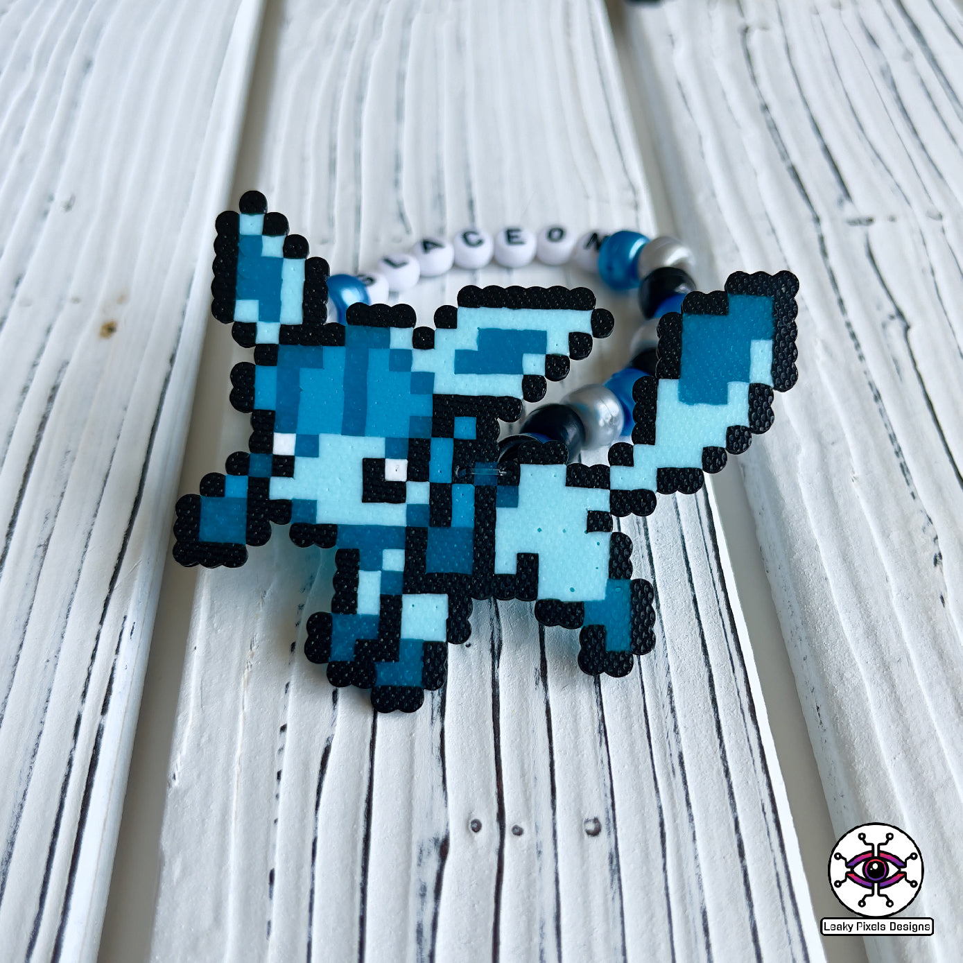 Eeevee pokemon evolutions perler bracelets. Vaporeon, Jolteon, Flareon, Espeon, Umbreon, Leafeon, Glaceon, and Sylveon by leaky pixels.