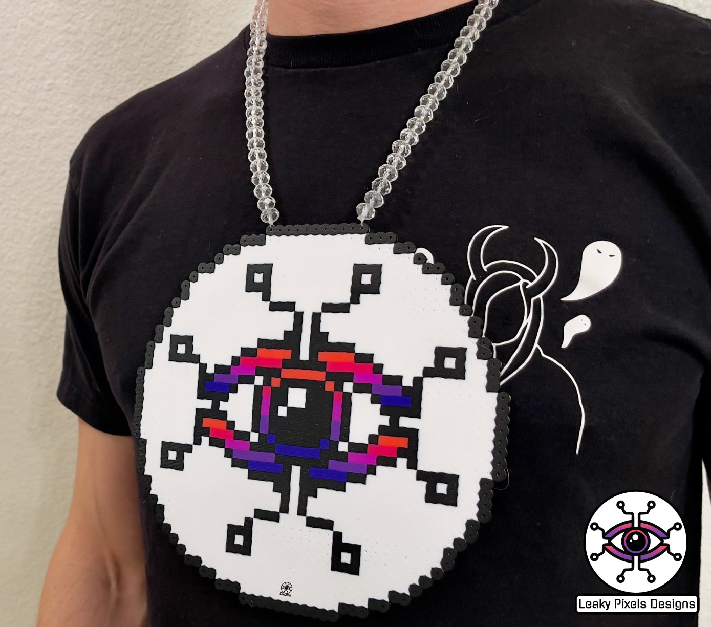 Leaky pixels logo with dilate eye in center