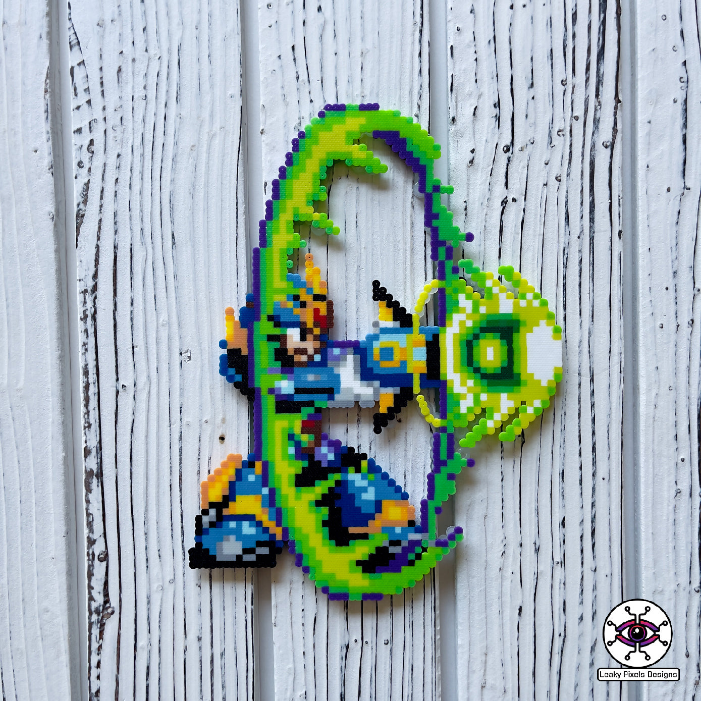 mega man x4 perler necklace by leaky pixels. shooting his x buster in a big green blast wave.