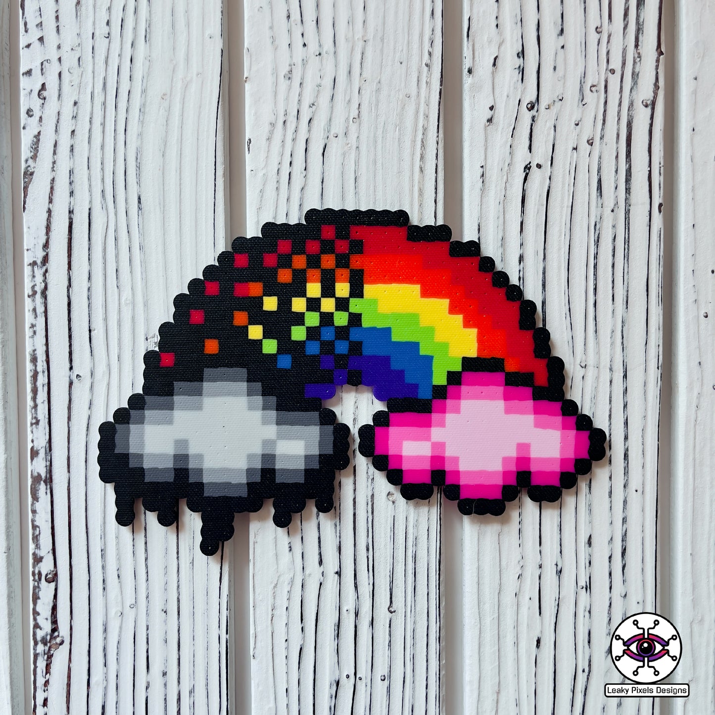 rainbow perler necklace by leaky pixels. red, orange, yellow, green, blue, purple and pink. black storm cloud and pink cloud.