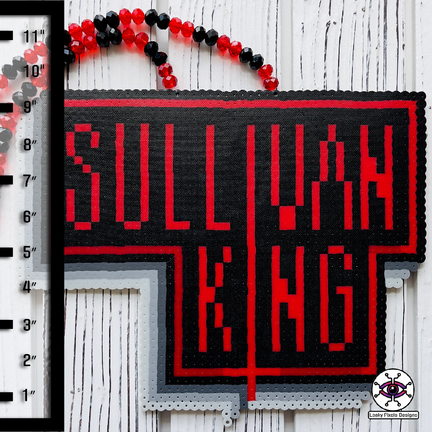 Sullivan king perler necklace by leaky pixels. red and black letters with red and black glass crystal beads