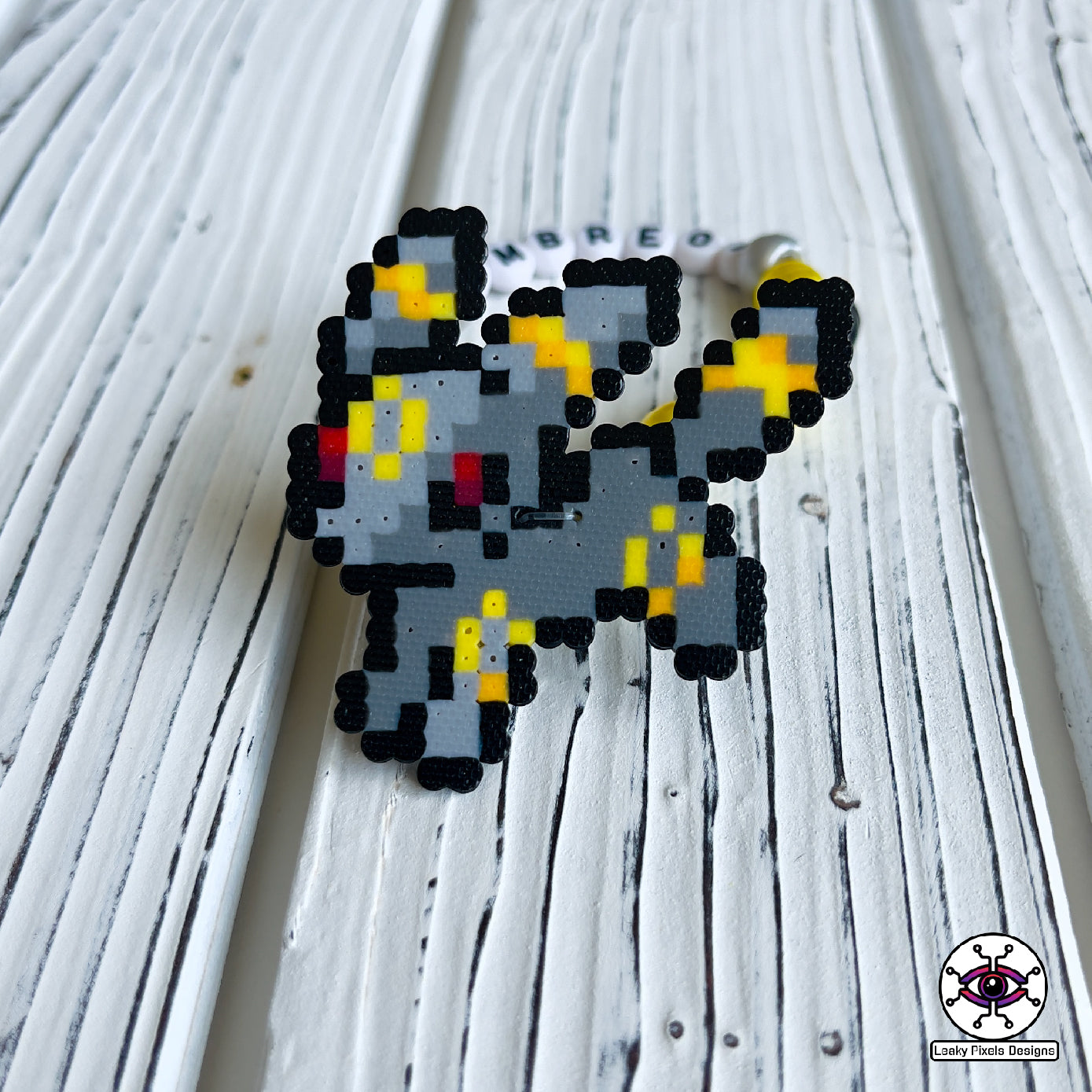 Eeevee pokemon evolutions perler bracelets. Vaporeon, Jolteon, Flareon, Espeon, Umbreon, Leafeon, Glaceon, and Sylveon by leaky pixels.