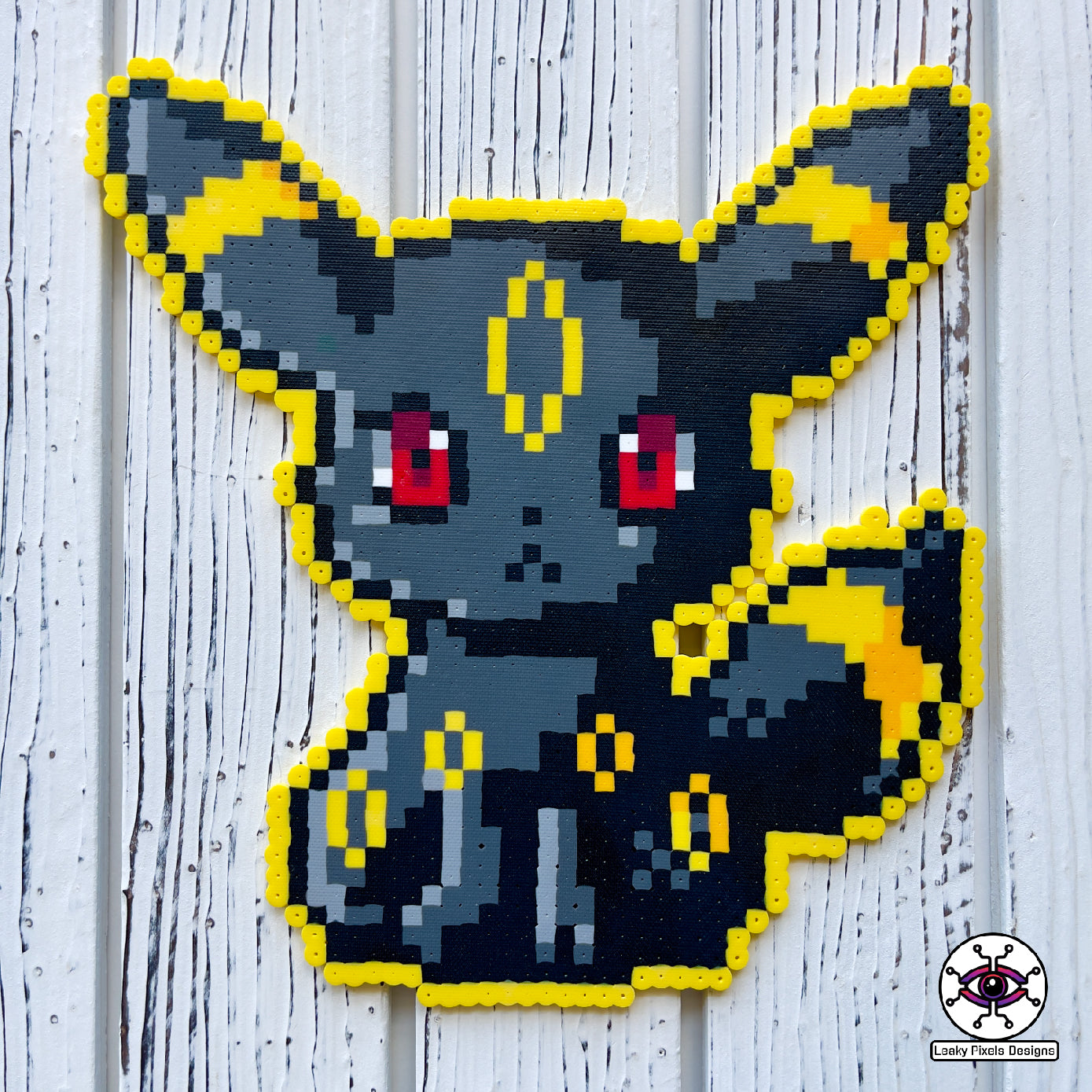 Umbreon pokemon Perler necklace black, with gold rings and red eyes