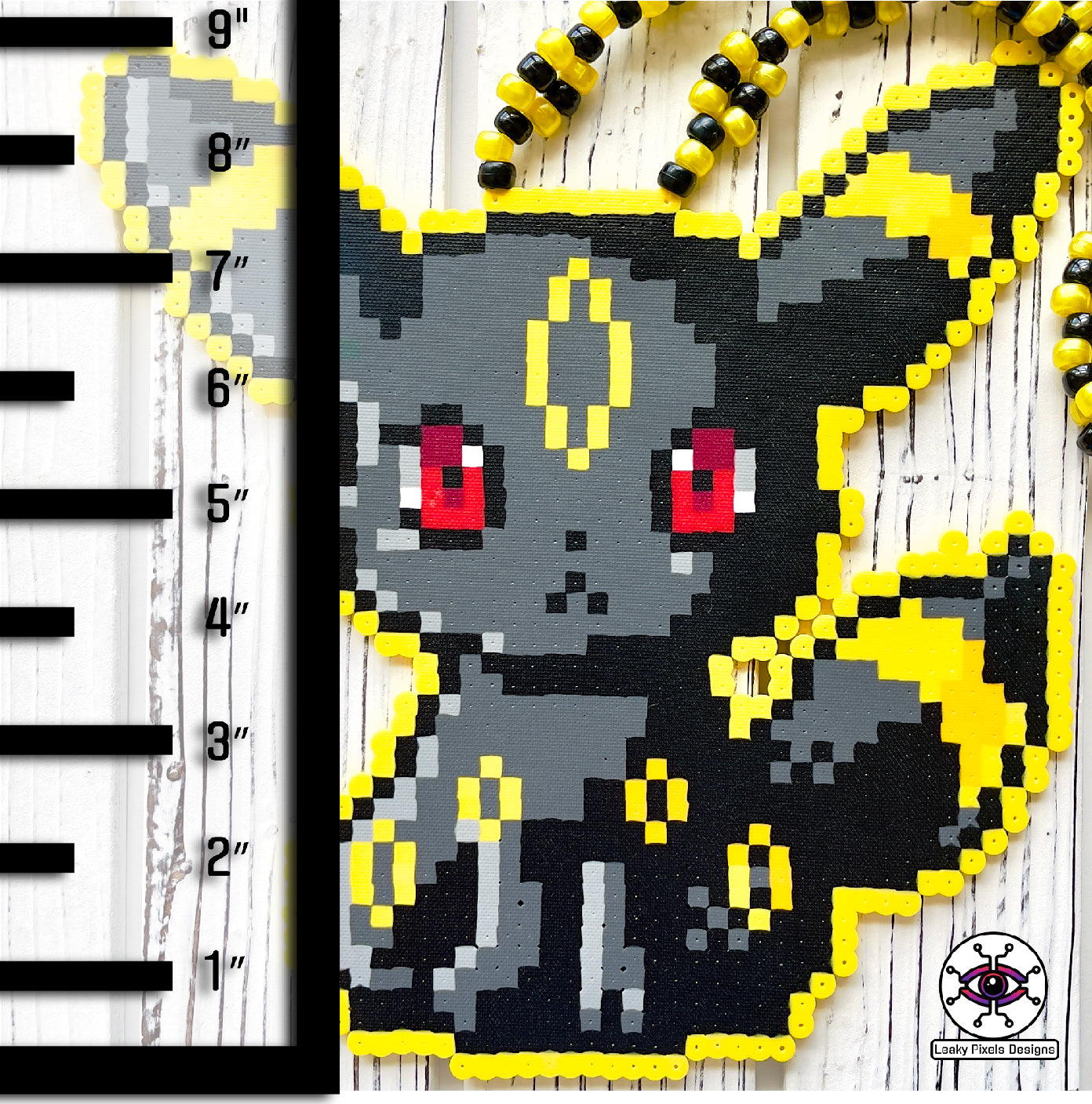 Umbreon pokemon Perler necklace black, with gold rings and red eyes