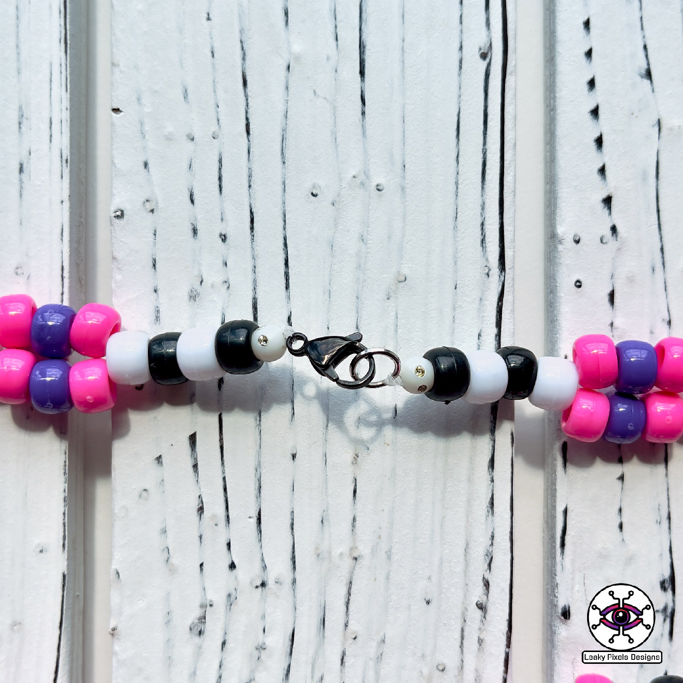 Unicorn skeleton perler necklace. purple hooves, pink hair and yellow horn by leaky pixels