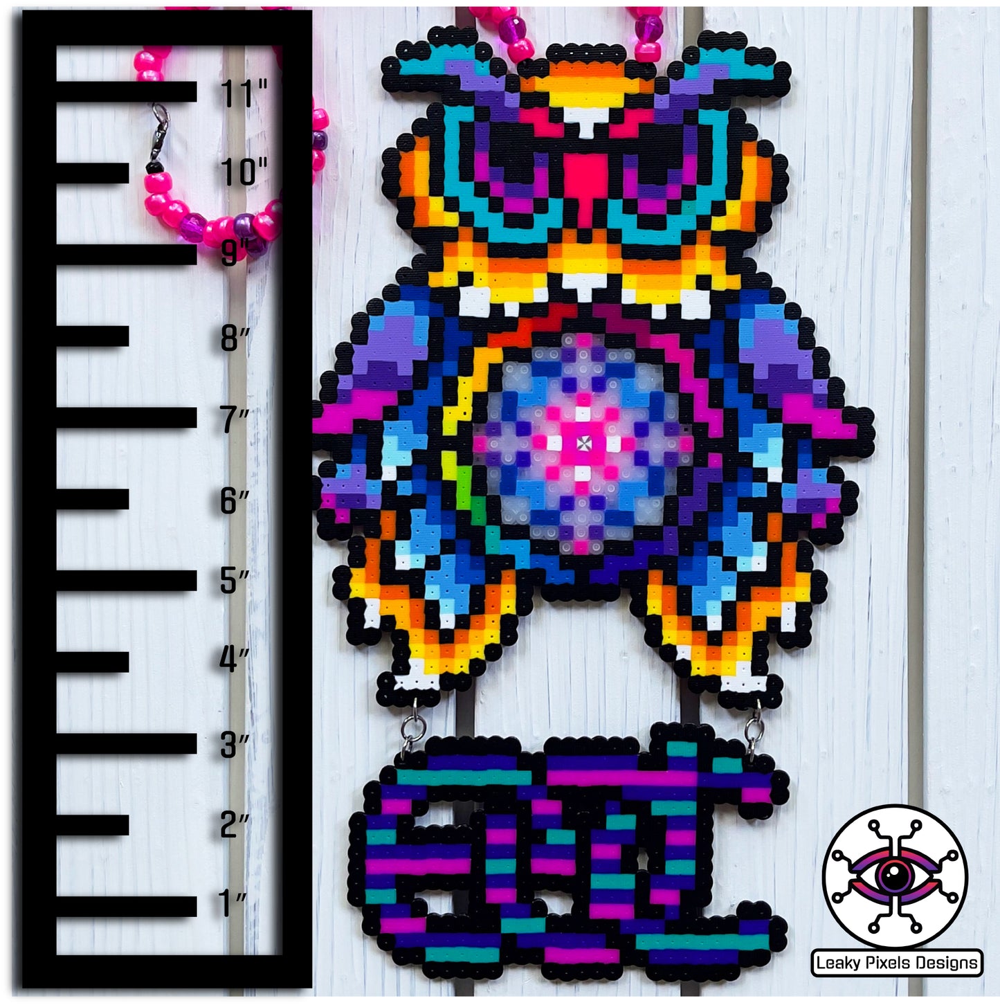 edc owl perler necklace. owl is different colors of the rainbow with the letters edc hanging from below