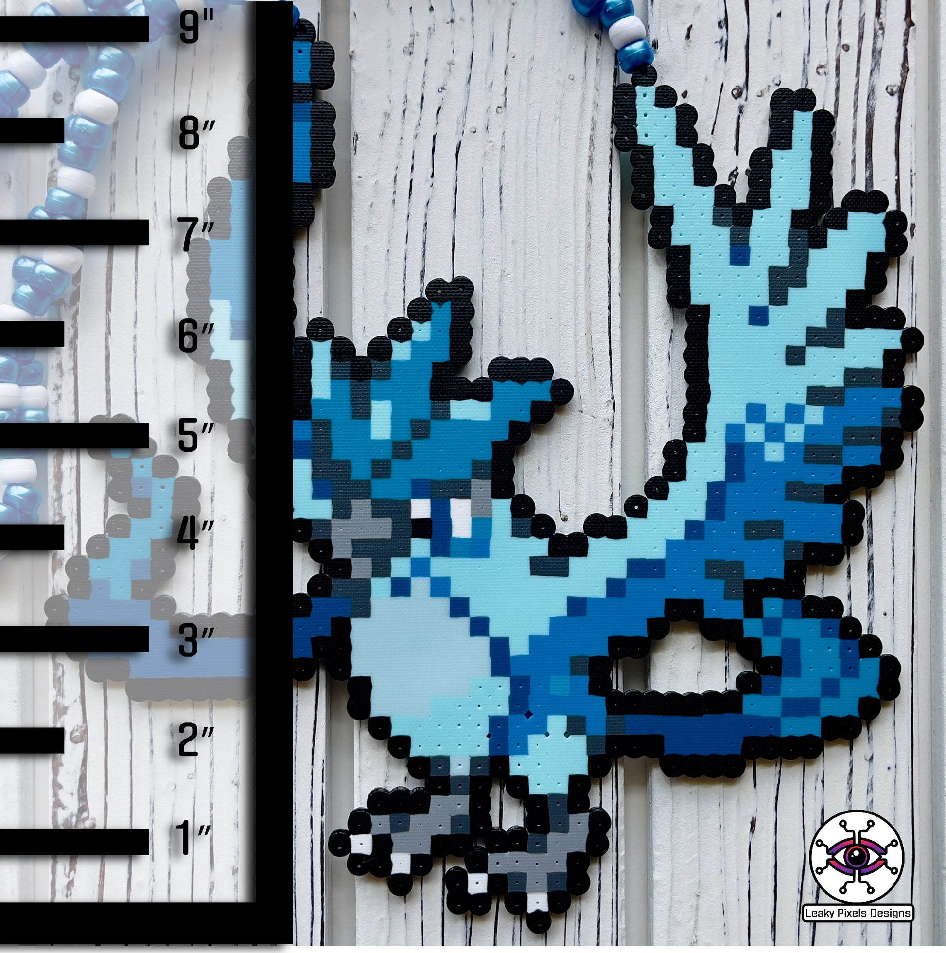 Articuno perler necklace by leaky pixels. blue legendary bird pokemon.