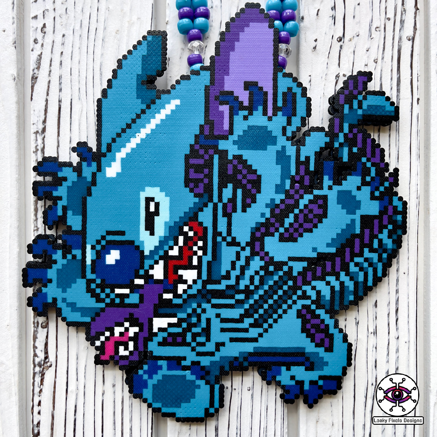 lilo and stitch perler necklace made by leaky pixels. blue and purple stitch/xenomoprh alien.