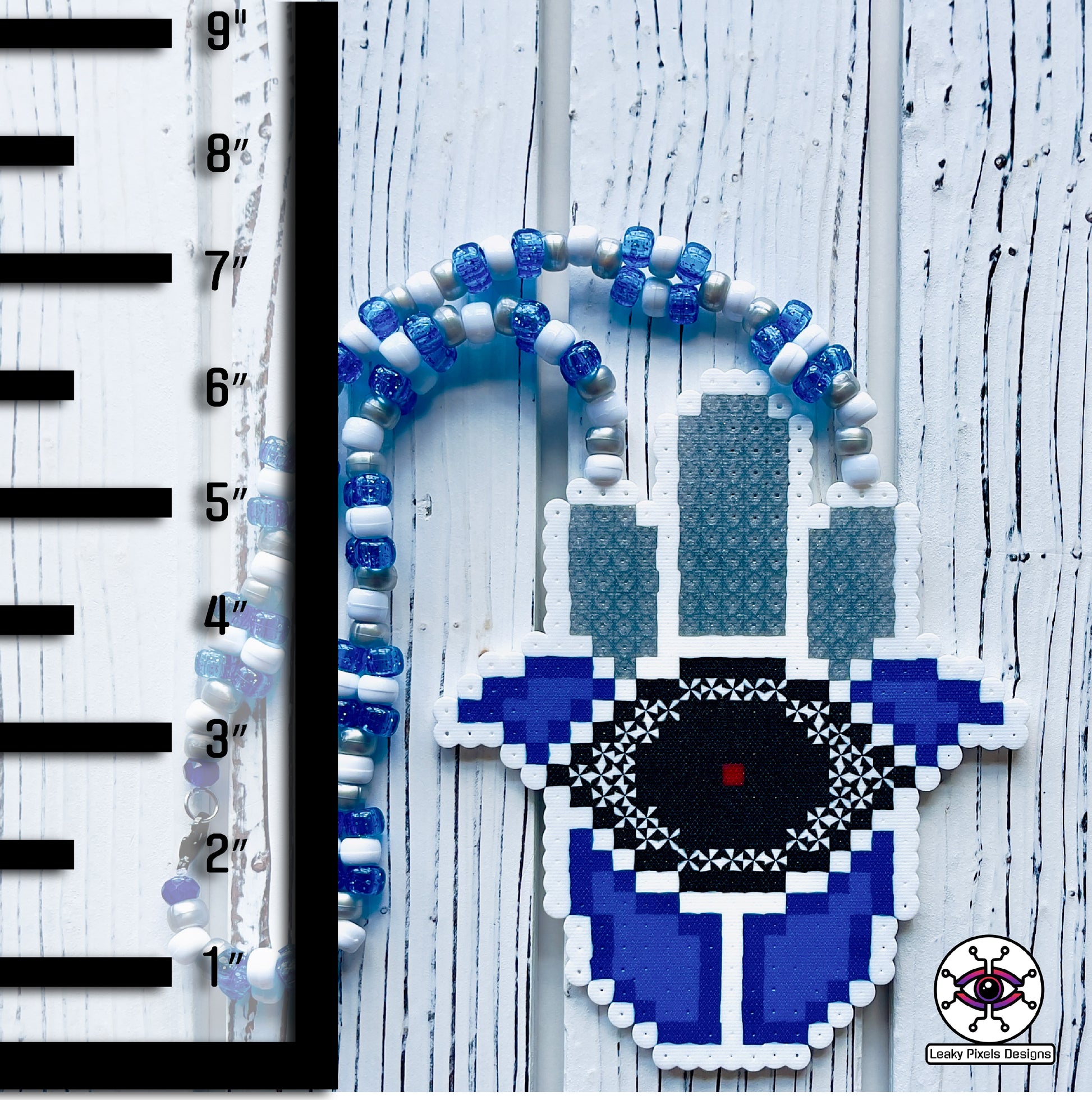 Evil eye perler necklace by leaky pixels. white and  blue with black eye