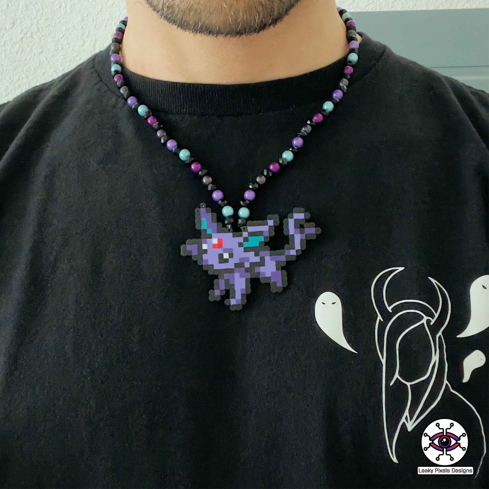 Mini espeon pokemon perler necklace made by leaky pixels.