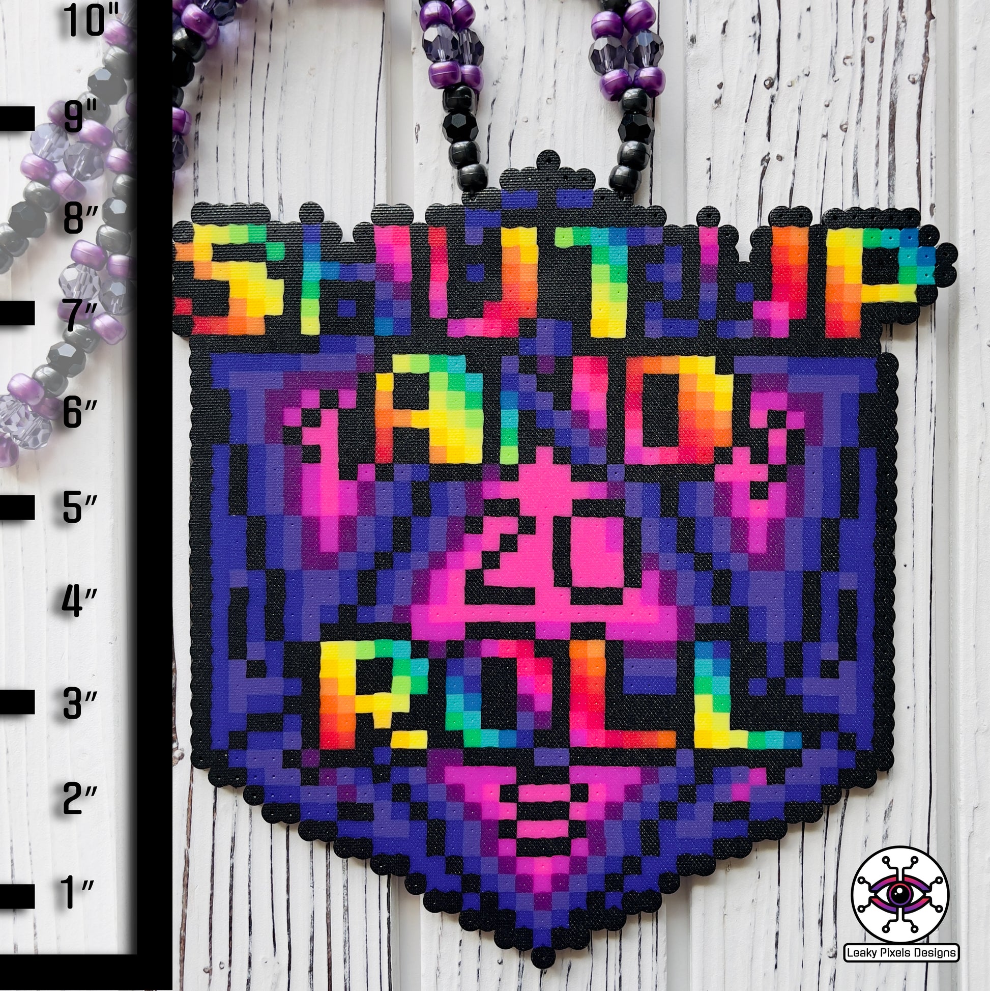 baldurs gate dungeons and dragons d20 dice perler necklace by leaky pixels. says shut up and roll on the front in rainbow letters