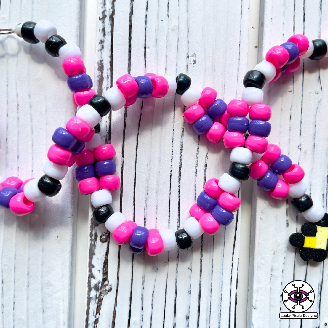 Unicorn skeleton perler necklace. purple hooves, pink hair and yellow horn by leaky pixels