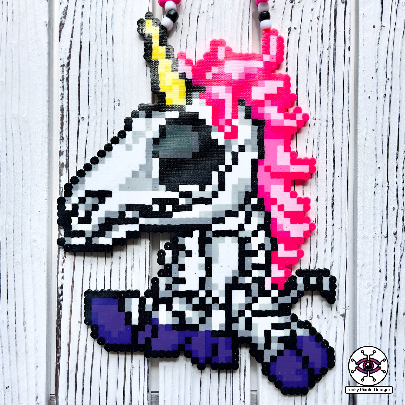 Unicorn skeleton perler necklace. purple hooves, pink hair and yellow horn by leaky pixels