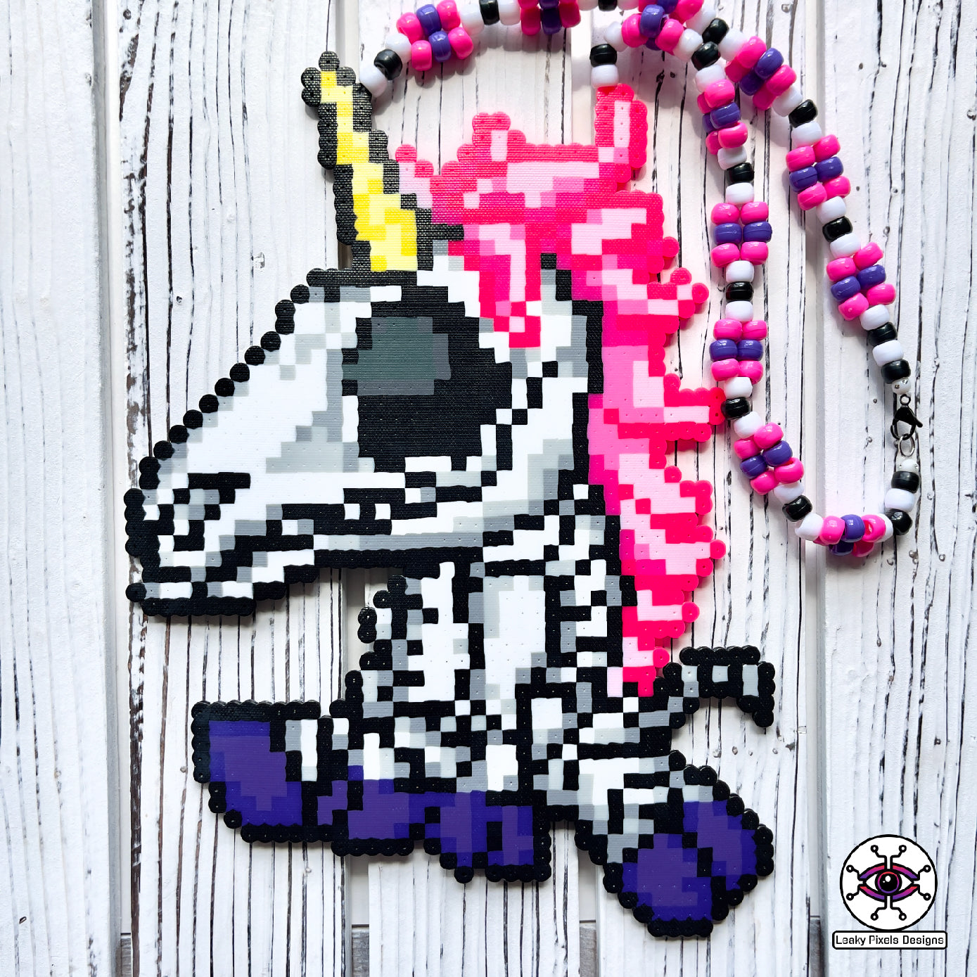 Unicorn skeleton perler necklace. purple hooves, pink hair and yellow horn by leaky pixels