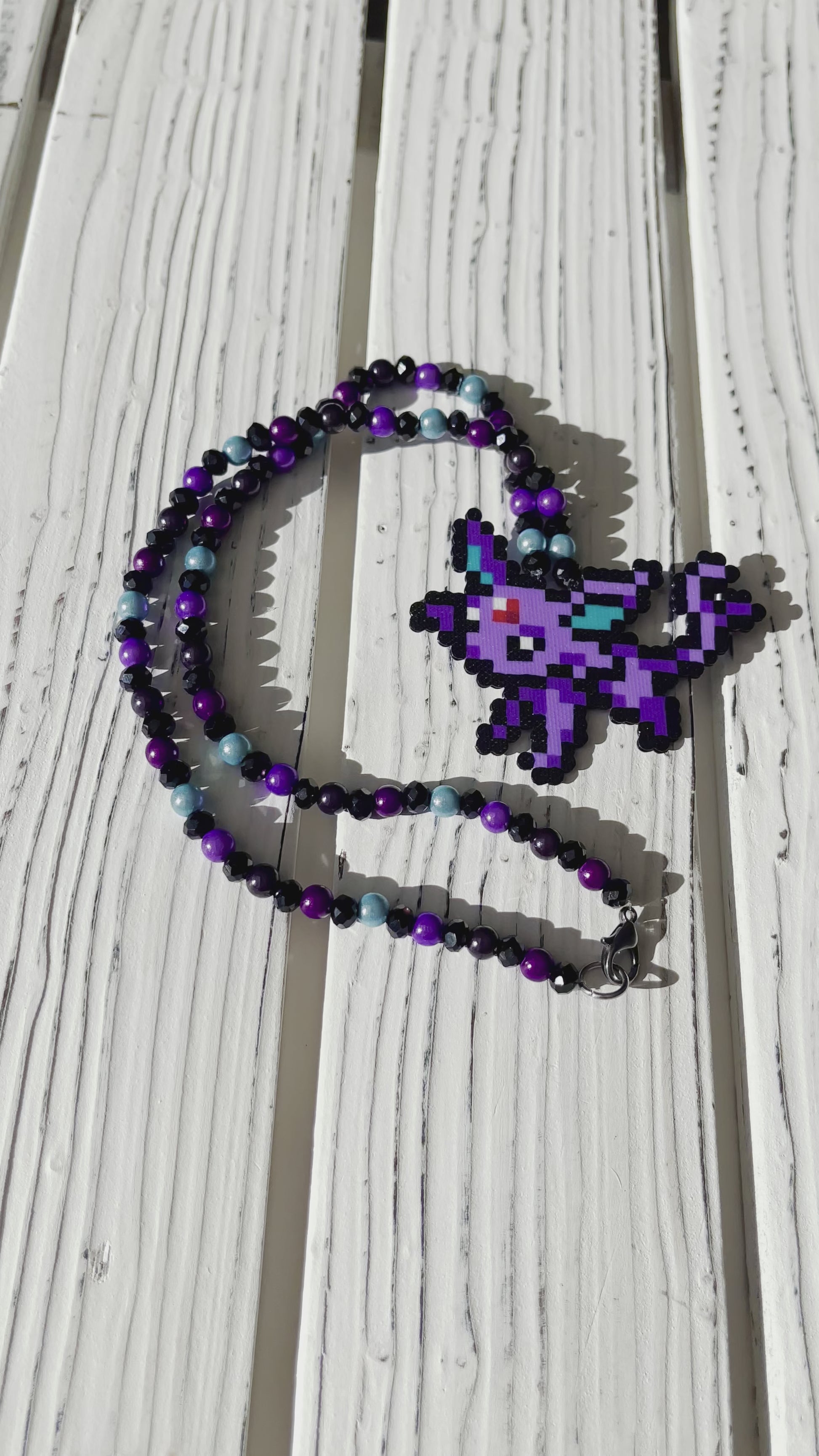 Mini espeon pokemon perler necklace made by leaky pixels.